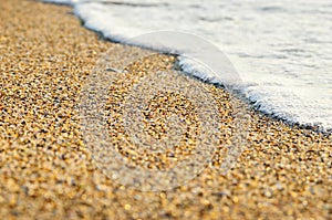 Tidal wave on a clean, sandy, sea beach