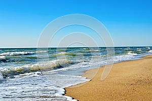 Tidal wave on a clean, sandy, sea beach