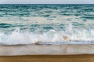 Tidal waves on a sandy beach