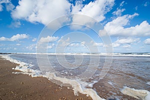 Tide on the beach of the North Sea