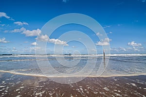 Tide on the beach of the North Sea