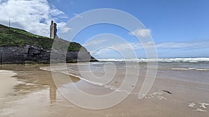 Tide with castle ruins in Ballybunion county Kerry Ireland on the wild Atlantic Way