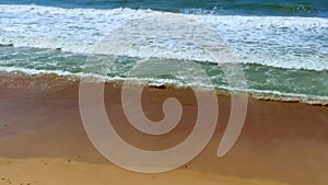 Tide waves on the ocean on a warm vacation day.