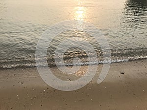 Tide waves and sunset reflection at Yung Shue Wan