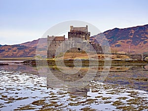 Tides in the lake at Eilean Donan Castle, Scotland. The popular stony bridge