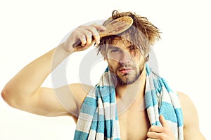 Tidiness and morning time idea. Guy with striped blue towel