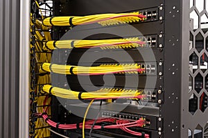 Tidy patched network cables, RJ45, connected to the switches and routers, data centre