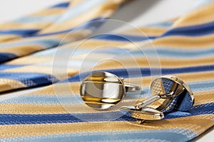 Tie, belt and cufflinks