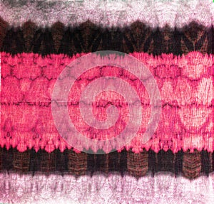 Tie dye ancient resist-dyeing techniques pink black textile pattern abstract background on cotton fabric simple motifs,