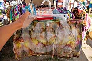 Tie and dye fabrics in a farmer`s market shop