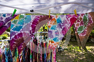 Tie and dye fabrics on a hanging wire