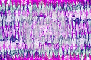 Tie dye pattern hand dyed on cotton fabric background