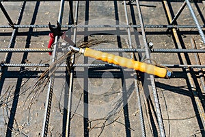 Tie rebar beam cage on construction site. Steel reinforcing bar for reinforced concrete