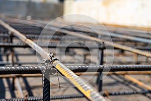 Tie rebar beam cage on construction site. Steel reinforcing bar for reinforced concrete photo