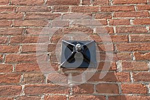 tie rod on the wall of an exposed brick building with construction detail of the shaped anchor plates