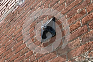 tie rod on the wall of an exposed brick building with construction detail of the shaped anchor plates