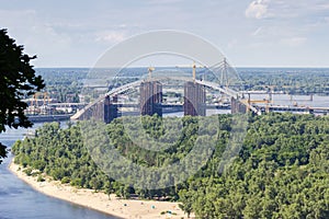 Tied arch bridge across river during construction, Kyiv, Ukraine