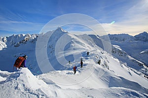 Tied climbers climbing mountain with snow field tied photo