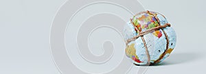 Tied earth globe, web banner format