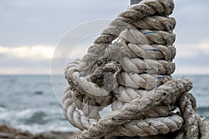 Tied fishing rope, sea background