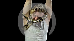 Tied man with snake on his neck