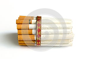 Tied in a pile of cigarettes on a white background.