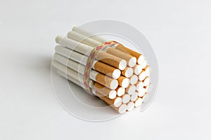 Tied in a pile of cigarettes on a white background.