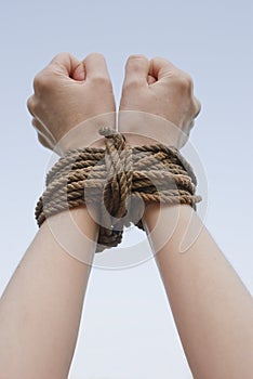 Tied with rope hands photo