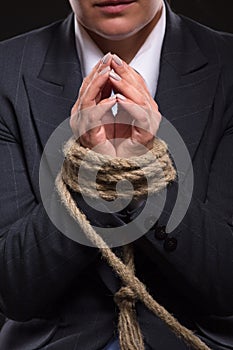 Tied up hands with rope