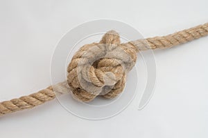 Tied up rope knot isolated on a white background