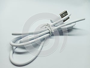 Tied White USB Cable on White Background