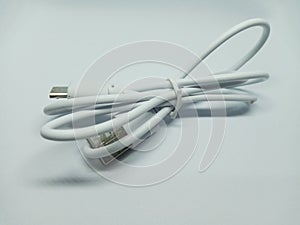 Tied White USB Cable on White Background