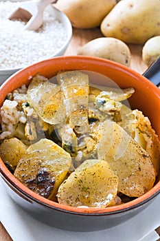 Tiella of potatoes, rice and mussels.