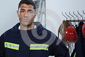 Tiered fireman standing in the office