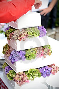 Tiered wedding cake with flower