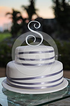 Tiered wedding cake outdoors