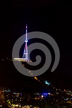 Tiflis tv tower illuminated at night photo