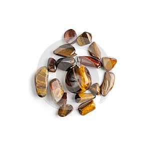 Tiger eye pebbles isolated, brown polished quartz stones