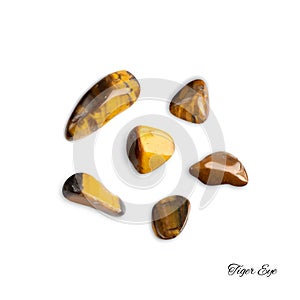 Tiger eye pebbles isolated, brown polished quartz stones