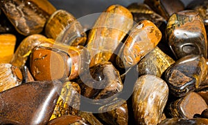 Tiger`s eye and hawk`s eye gemstone as  mineral rock