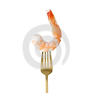 Tiger shrimp or prawn on golden fork isolated on white