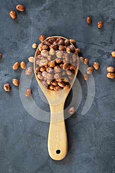 Tiger Stripe Peanut in wooden spoon