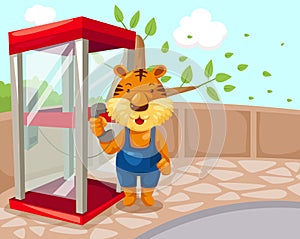 Tiger using phonebooth photo