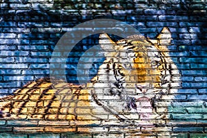 Tiger in water painting on brick wall
