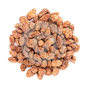 Tigernuts isolated on white background. Pile of chufa nuts or tiger nuts. Top view photo