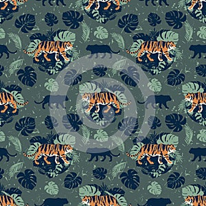Tigers on a background of tropical leaves. Seamless pattern