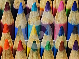 Tight close up of colored pencil points from the front.