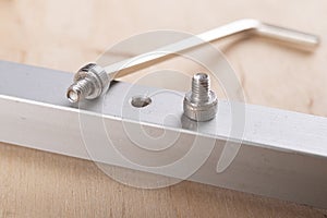 Tighten the small screws with an Allen key. Locksmith works in the workshop