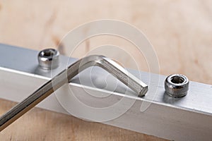 Tighten the small screws with an Allen key. Locksmith works in the workshop