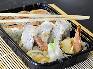 Tightly packed sushi rolls on platter